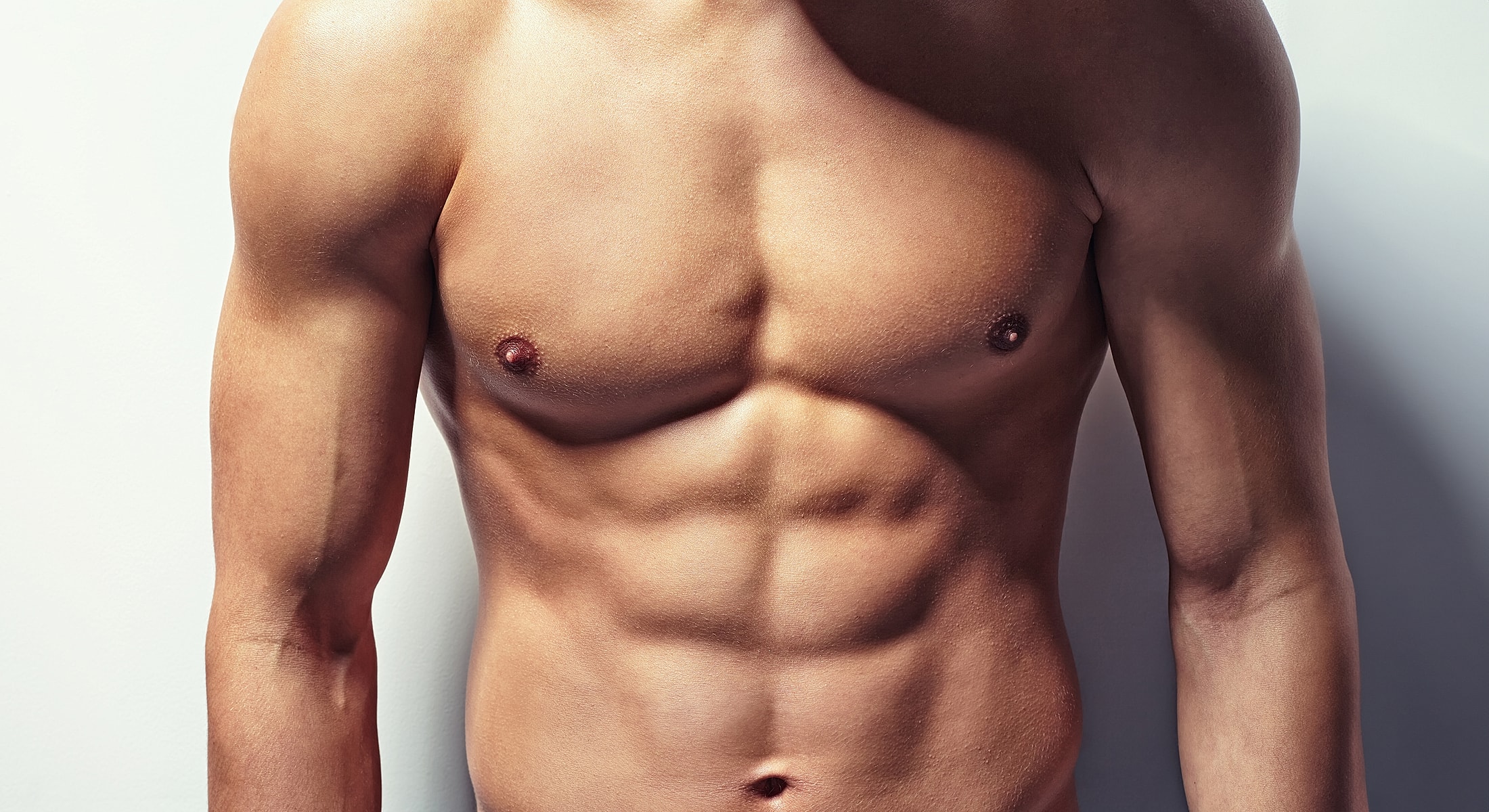 Male torso with defined abs and muscular arms